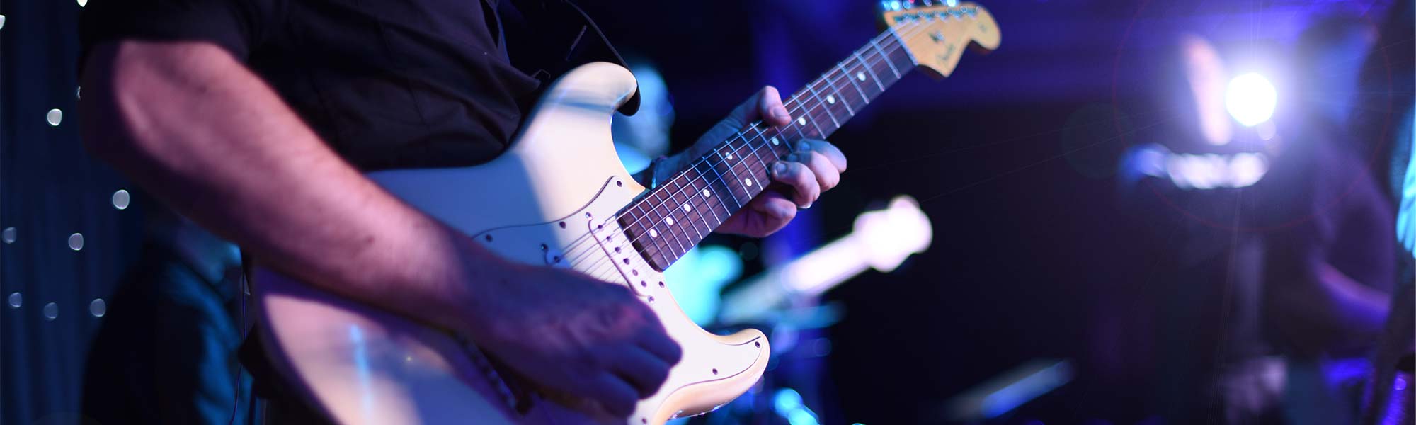 Close up of Stu Mackinnon's Fender Stratocaster during a Discography wedding performance